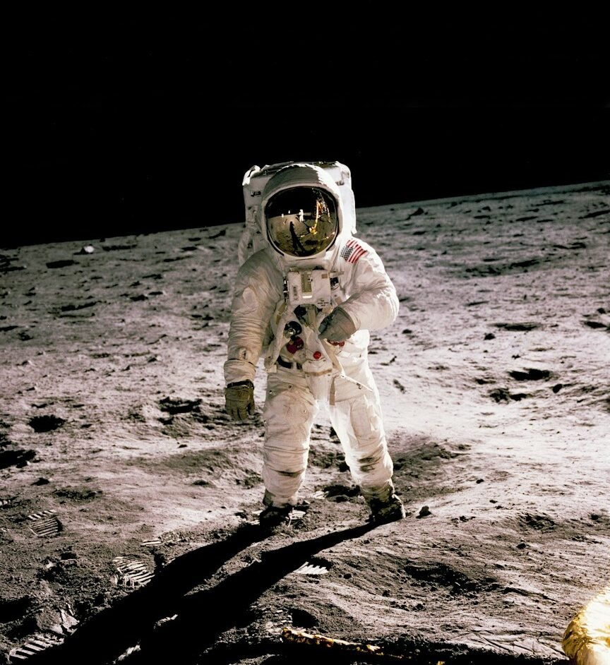 astronaut standing on the moon